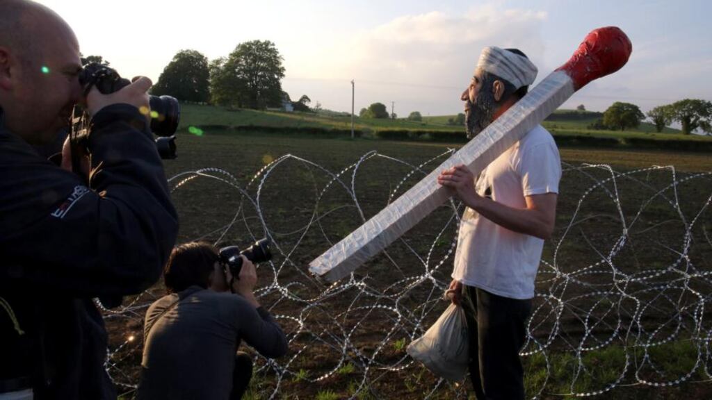 A protester dressed as Osama Bin Laden at the security fencing outside the G8 summit in Lough Erne, Co Fermanagh. Photograh: Paul Faith/PA Wire