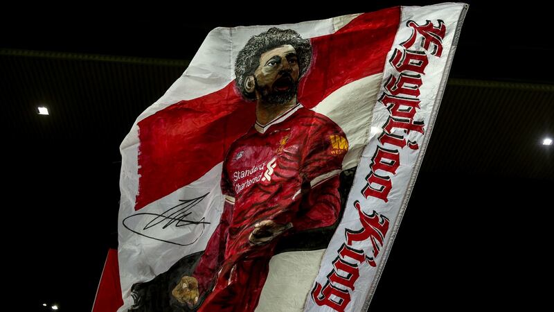 Liverpool fans wave a Salah flag in the Kop. Photo: Robbie Jay Barratt - AMA/Getty Images