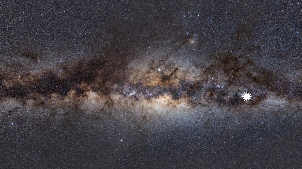 The Milky Way as viewed from Earth, with a star icon (at R-placed by source) marking the position of a mysterious repeating transient in space. Photograph: Natasha Hurley-Walker/International Centre for Radio A/AFP