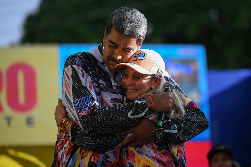 Venezuelan president and presidential candidate Nicolas Maduro hugs his wife, Cilia Flores, during a campaign rally in Caracas on Tuesday. Photograph: Federico Parra/AFP via Getty