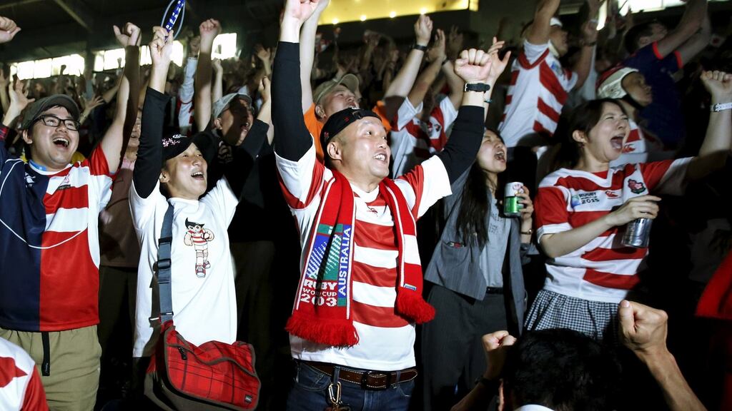 Japan rugby fans celebrate their team’s second try as they watch Japan’s IRB Rugby World Cup 2015 Pool B match against Samoa at a public viewing event in Tokyo. Photograph: Issei Kato/Reuters