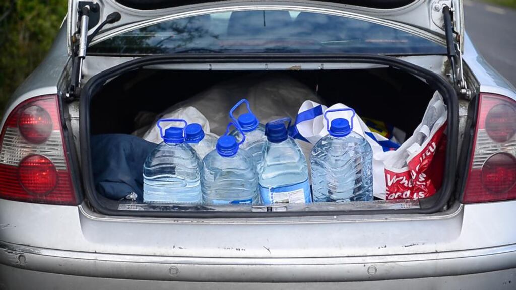 Roscommon resident fills up water containers from a well. File Photograph: Bryan O’Brien/The Irish Times