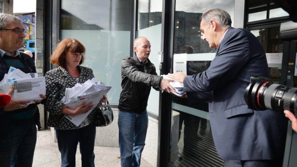 Protesters from the ‘We Won’t Pay’ campaign returning water packs collected at protests to Pearse Roe, of Irish Water, earlier this month. Photograph: Alan Betson/The Irish Times