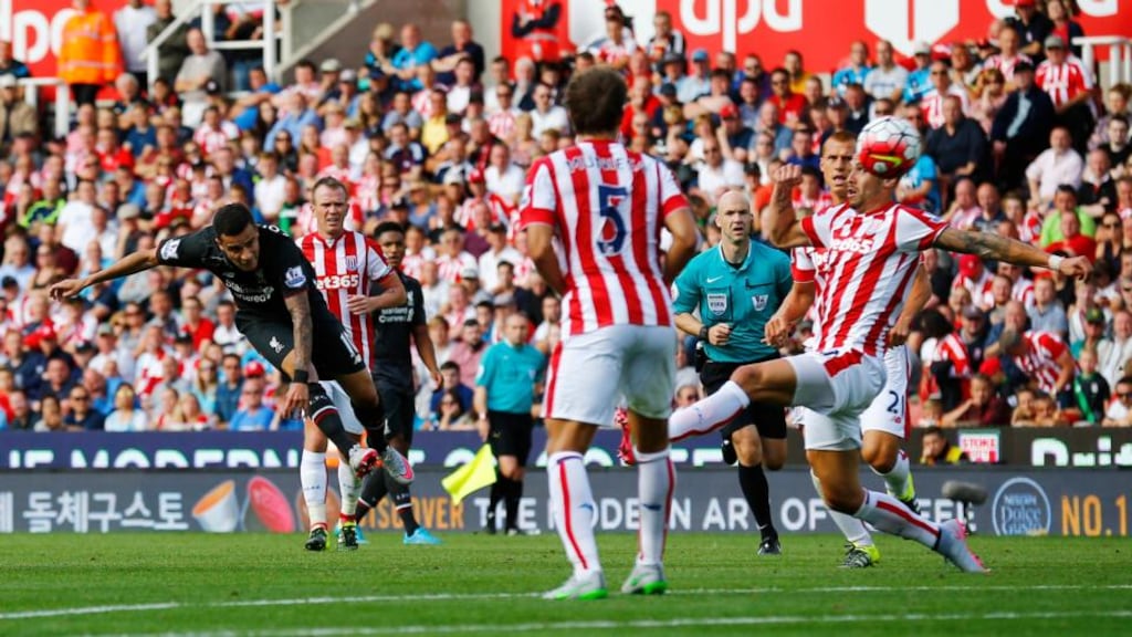 Philippe Coutinho scores Liverpool’s winning goal during the Premier League game against Stoke City at the Britannia Stadium. Photograph: Darren Staples/Reuters/Livepic