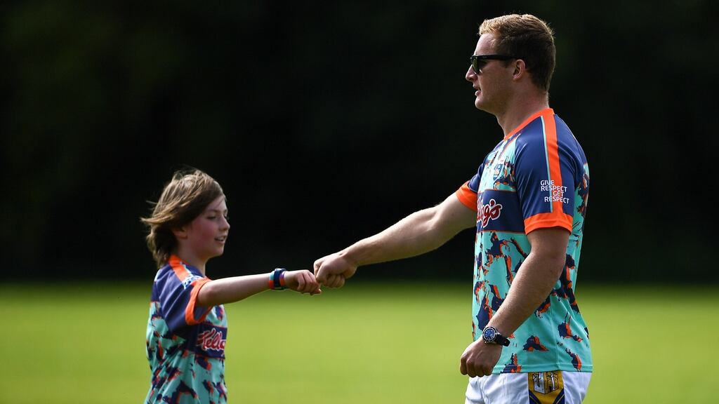 Dublin footballer Ciarán Kilkenny with Thomas Keville at the Kellogg’s GAA Cúl Camp in St Brendan’s GAA Club, Dublin.  “To be even going out playing games, playing the games that we love, playing with your friends, we are just lucky to be in that position.”Photograph: Harry Murphy/Sportsfile