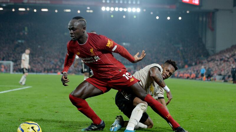 Mané is tackled by Fred. Photo: Peter Powell/Getty Images