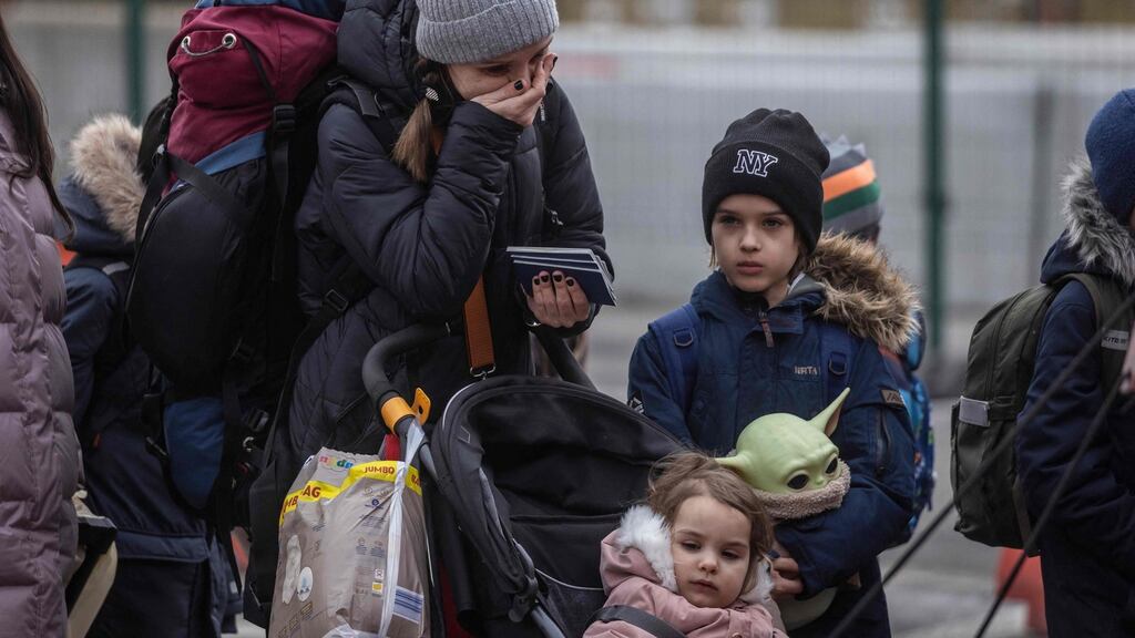 Refugees from Ukraine after crossing the Ukrainian-Polish border at Korczowa. Photograph: Wojtek Radwanski/AFP via Getty Images