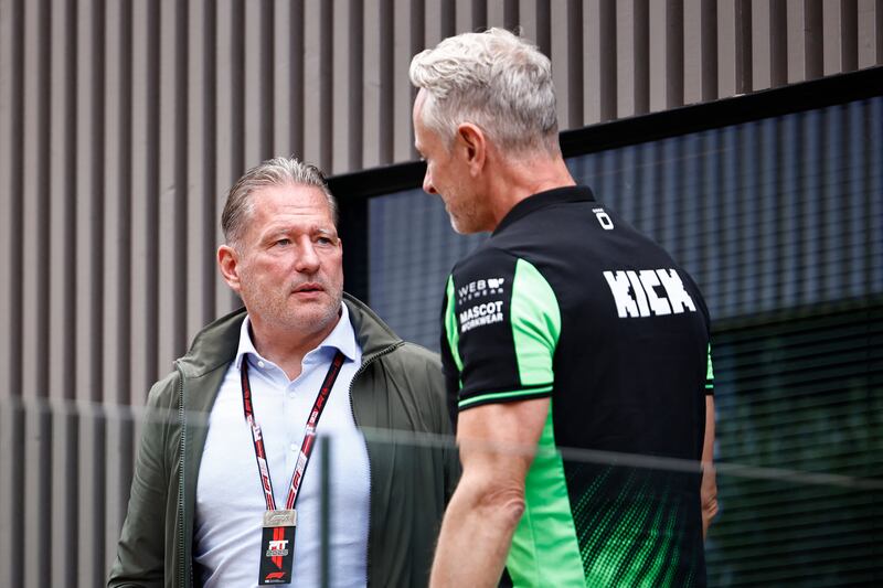 Jos Verstappen, former F1 driver and father of Max Verstappen, talks with a Kick Sauber's official ahead of the start of the first practice session for the Belgian Grand Prix at Spa-Francorchamps. Photograph: Simon Wohlfahrt/AFP via Getty Images