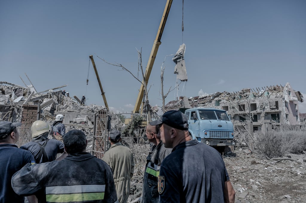Rescue workers clear debris following a Russian missile strike in the Serhiivka village of the Bilhorod-Dnistrovskyi district, southwest of Odesa, Ukraine. Photograph: Laetitia Vancon/The New York Times