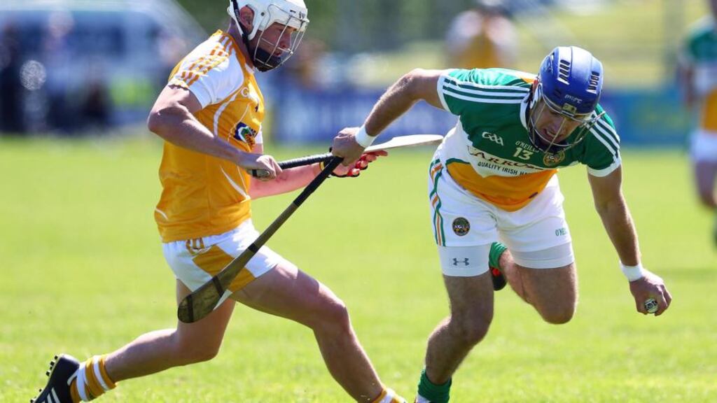 Antrim’s Aaron Graffin clashes with Offaly’s Brian Carroll during their All-Ireland senior hurling championship match at Ballycastle, Co Antrim. Photograph: Inpho