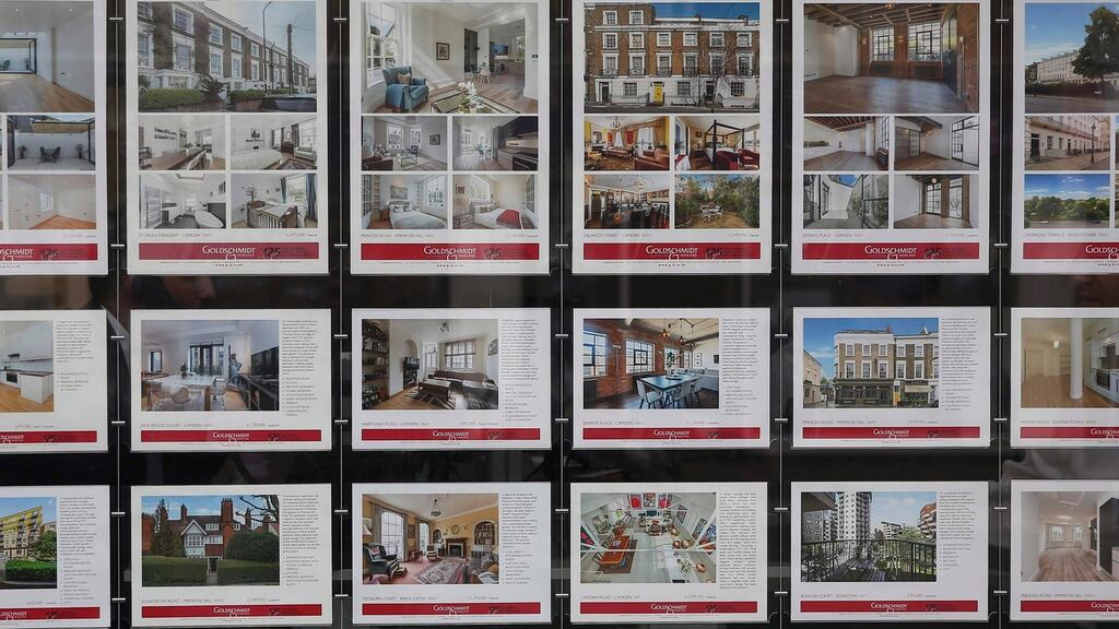 Property adverts in the window of an estate agents in London. UK property lender Halifax said it was too early to tell how much Brexit had dampened the housing market. Photograph: Neil Hall/Reuters