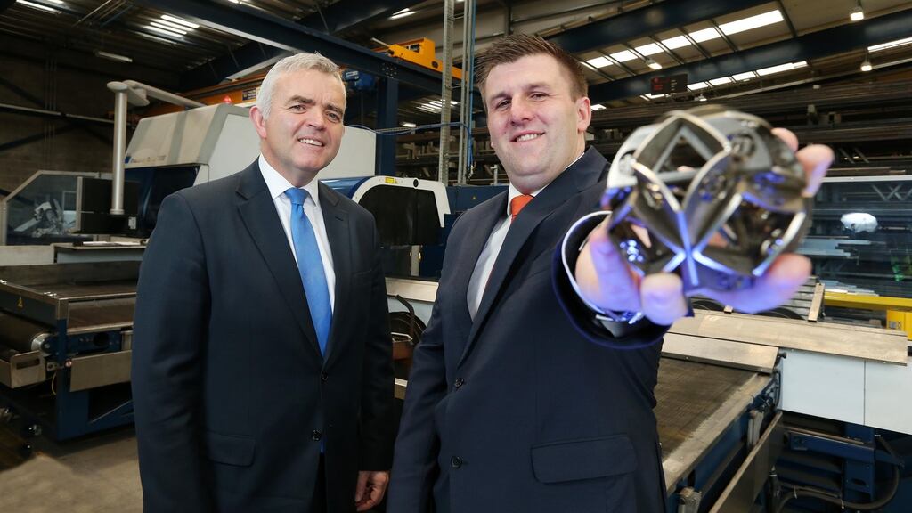Enterprise, Trade and Investment Minister, Jonathan Bell is pictured with Mark Hutchinson. Photograph: Kelvin Boyes / Press Eye