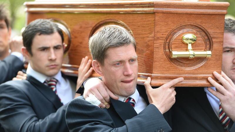 Munster’s Ronan O’Gara carrying Donal Walsh’s coffin at the church. Photograph: Domnick Walsh/Eye Focus