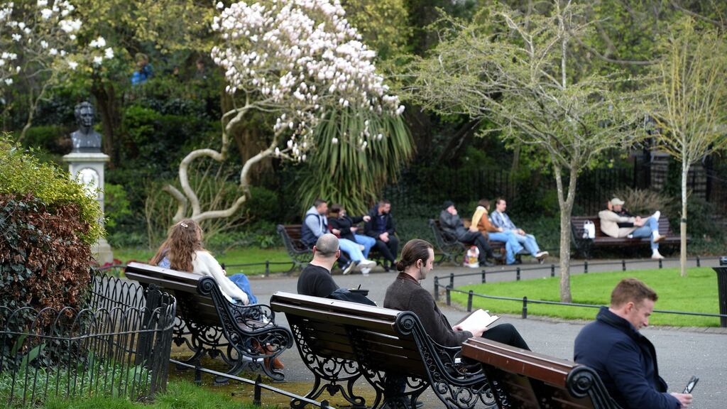 People relaxing in St Stephen’s Green in Dublin this week. Consumer sentiment has risen this month. Photograph: Dara Mac Donaill