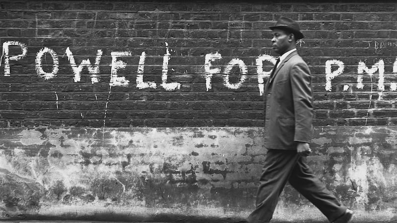A man walks past graffiti in support of Enoch Powell. Photograph: Hulton-Deutsch Collection//Corbis via Getty Images
