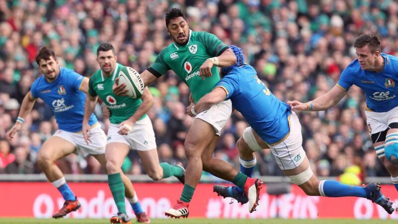 Bundee Aki offloads during Ireland’s win over Italy. Photograph: Brian Lawless/PA