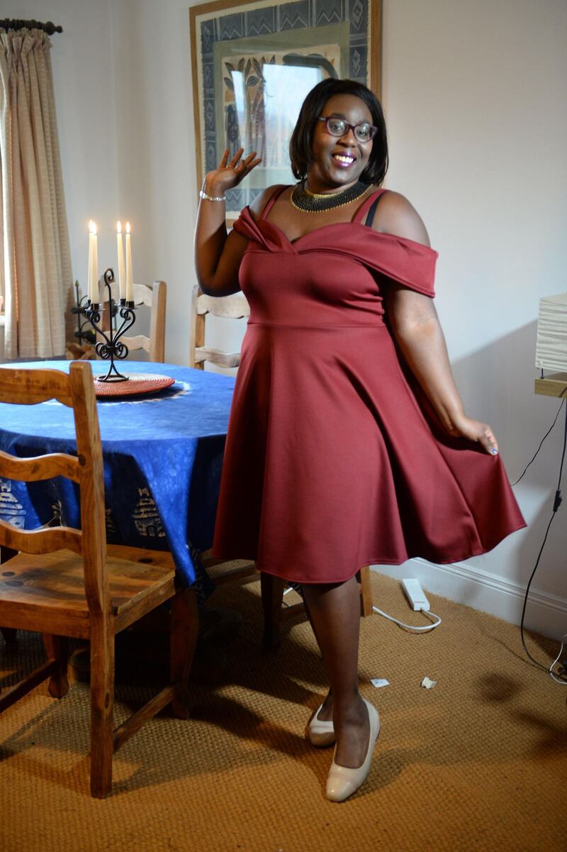Alima Doumbouya in her party dress at home in Ringsend, Dublin. Photograph: Dara Mac Dónaill/ The Irish Times