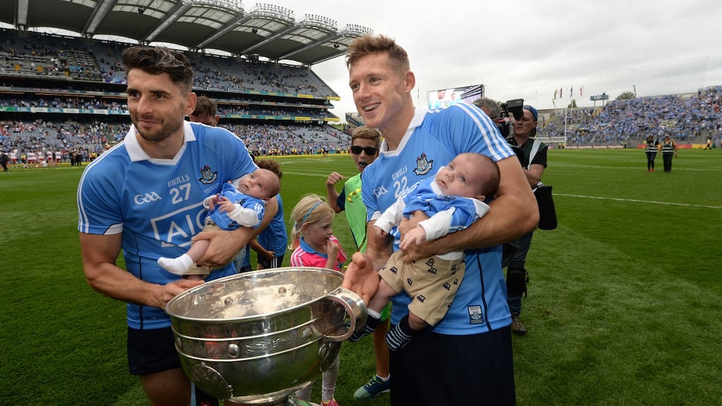 Paul Flynn (right) gives Bernard Brogan a hand with his twins Keadan and Donagh as Dublin celebrate beating Tyrone in the GAA All-Ireland senior championship final on September 2nd, 2018.Photograph: Dara Mac Dónaill