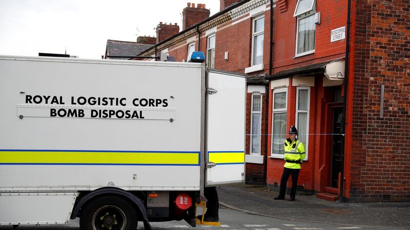 A bomb disposal unit and a police officer stand outside a street in Moss Side, Manchester on May 27, 2017. Photograph: REUTERS/Phil Noble