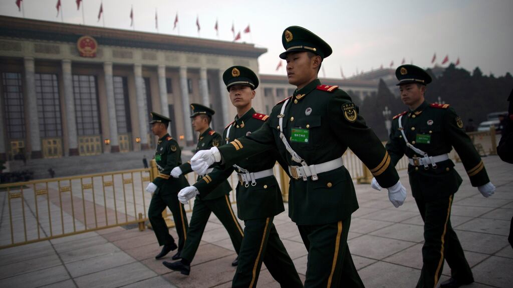 Chinese paramilitary police officers patrol outside Great Hall of the People before the opening of the second session of the 13th National People’s Congress in Beijing. Photograph: How Hwee Young/EPA
