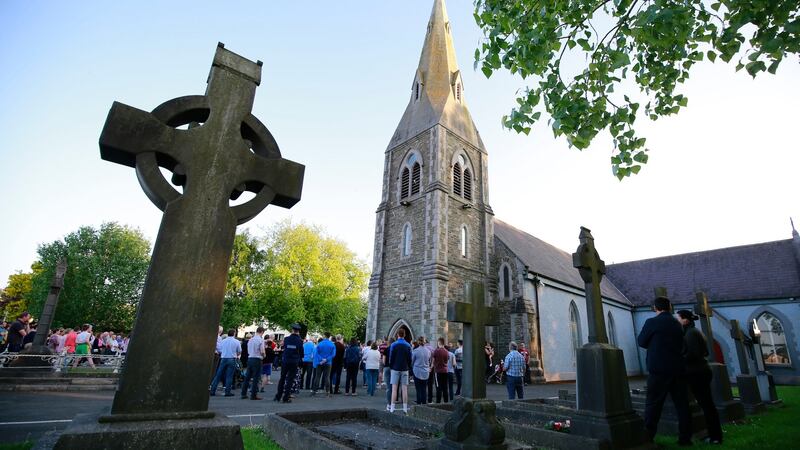 Crowds gather at St Brigid’s Church in Dunleer, Co Louth to hold a candlelit vigil for Cameron Reilly, whose body was found in a field close by. Photograph: Nick Bradshaw