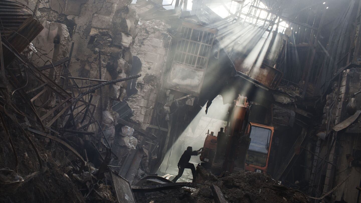Life in a war zone: fire-destroyed buildings in Damascus. Photograph: Declan Walsh/New York Times