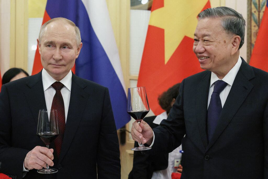 Russia's president Vladimir Putin and Vietnam's president To Lam raise a glass toast during a reception at the Hanoi Opera House in Hanoi on Thursday. Photograph: Gavriil Grigorov/AFP via Getty Images