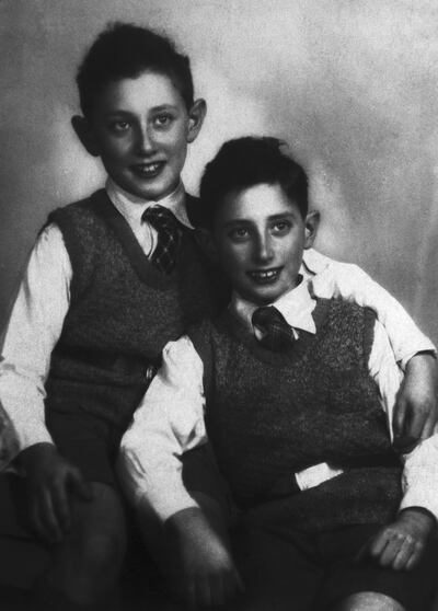 Henry Kissinger, at age 11, drapes his arm around his younger brother, Walter. Photograph: Bettmann Archive/Getty Images