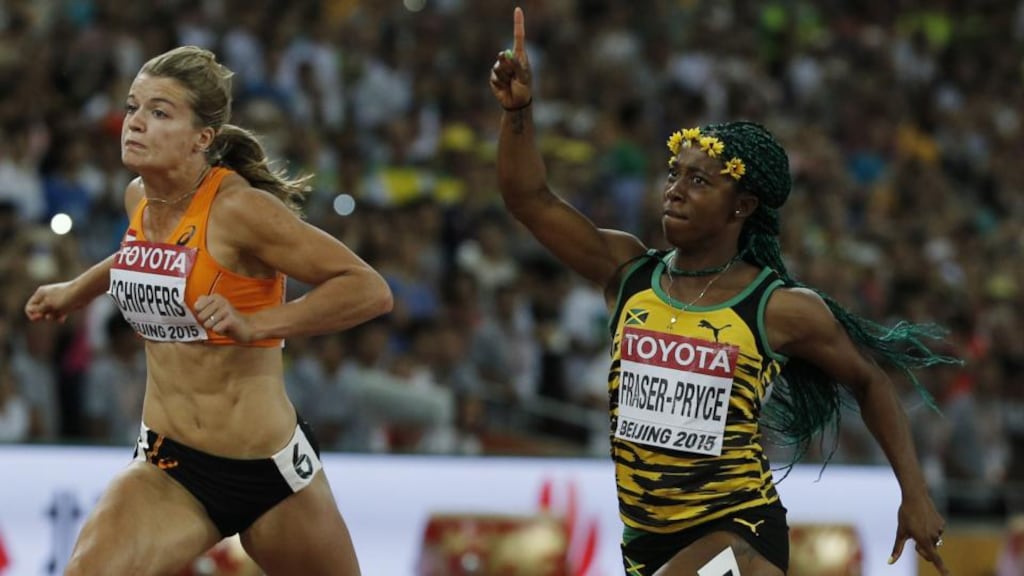 Jamaica’s Shelly-Ann Fraser-Pryce celebrates next to Netherlands’ Dafne Schippers as she wins the final of the women’s 100m at the World Championships in Beijing. Photograph: Adrian Dennis/AFP/Getty Images