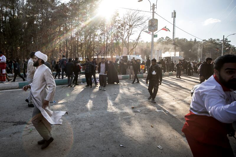 People flee after explosions at an event honouring a prominent Iranian general. Photograph: Mahdi Karbakhsh Ravari/AP