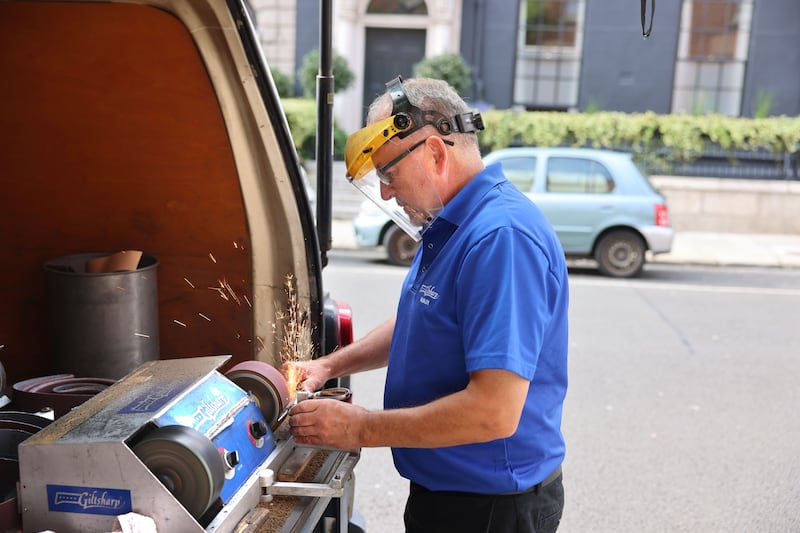 Denis Murphy: 'Most of the work is down alleyways of loading bays. It’s all set up in the back of the van with a generator for power.' Photograph: Dara Mac Dónaill