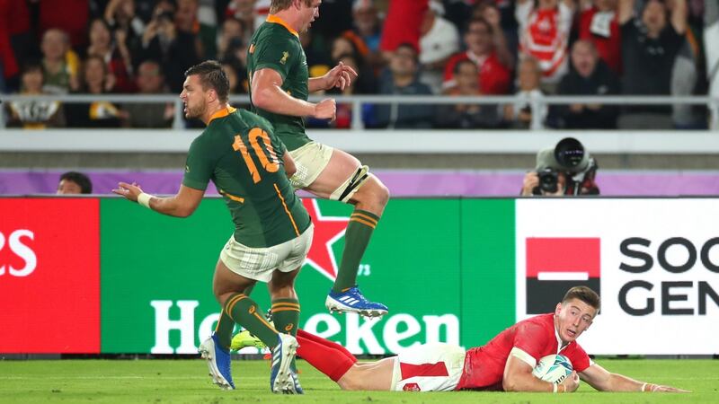 Josh Adams scores for Wales against the Springboks. Photograph: Cameron Spencer/Getty