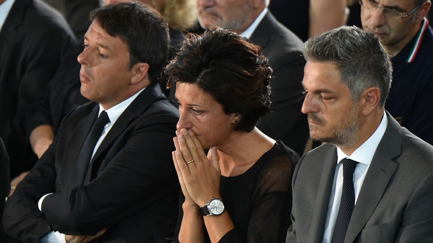Italian prime minister Matteo Renzi (left) and his wife Agnese during a mass funeral service at a gymnasium in Ascoli Piceno, three days after a 6.2-magnitude earthquake struck the region, killing 290 people. Photograph: Alberto Pizzoli/AFP/Getty Images
