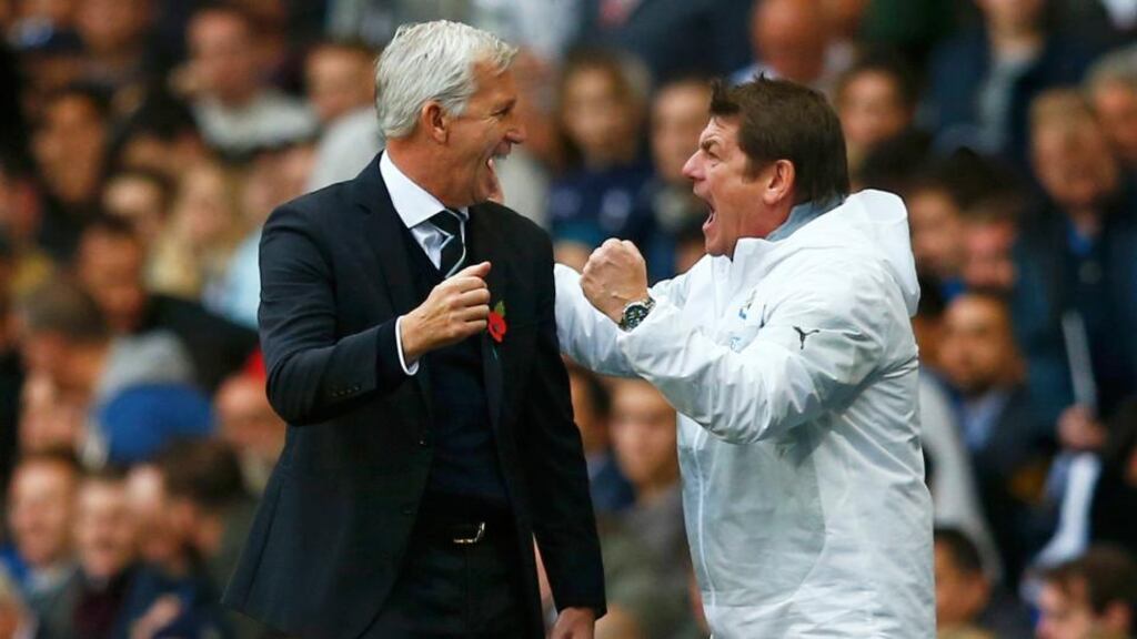 Newcastle United manager Alan Pardew and assistant manager John Carver celebrates their team’s Premier League victory against Tottenham Hotspur at White Hart Lane. Photograph: Andrew Winning/Reuters