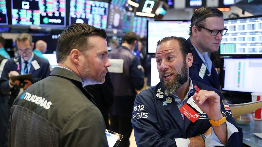 Traders work on the floor of the New York Stock Exchange. Photograph: Lucas Jackson/reuters