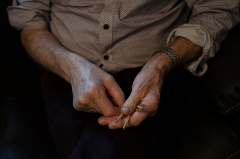 Peter Quinn shows the straws he uses to give the cure for warts