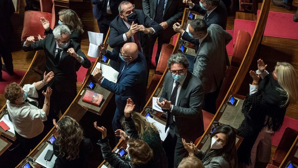 Five-star movement senators celebrate after prime minister Giuseppi Conte survived a confidence vote in the Italian senate in Rome. Photograph: Roberto Monaldo/EPA