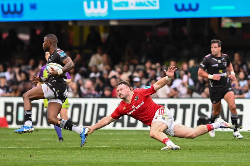Sean O’Brien of Munster tries to tackle Aphelele Fassi of Sharks at Kings Park, Durban on October 26th, 2024. Photograph: Darren Stewart/Inpho