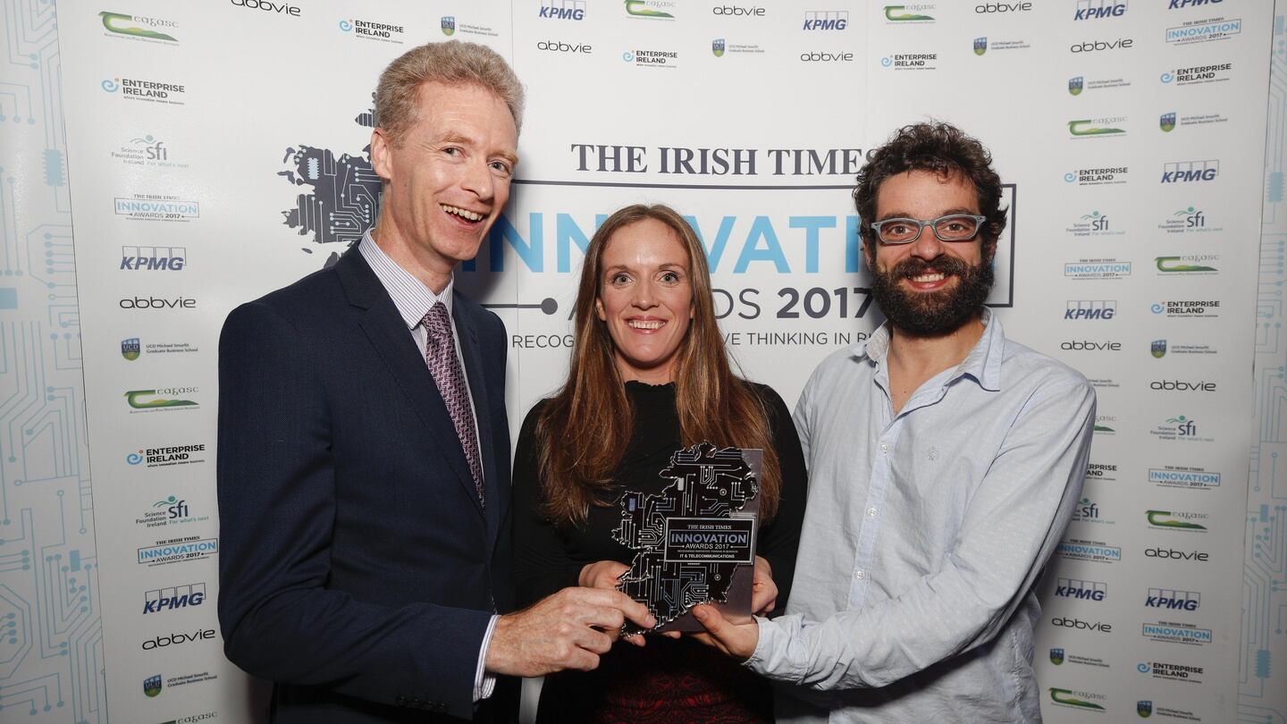 Mike O’Neill, UCD Smurfit School, presenting the award for IT and Telecommunications to Catherine Downes and Andrés Macías from Usheru. Photograph: Conor McCabe Photography