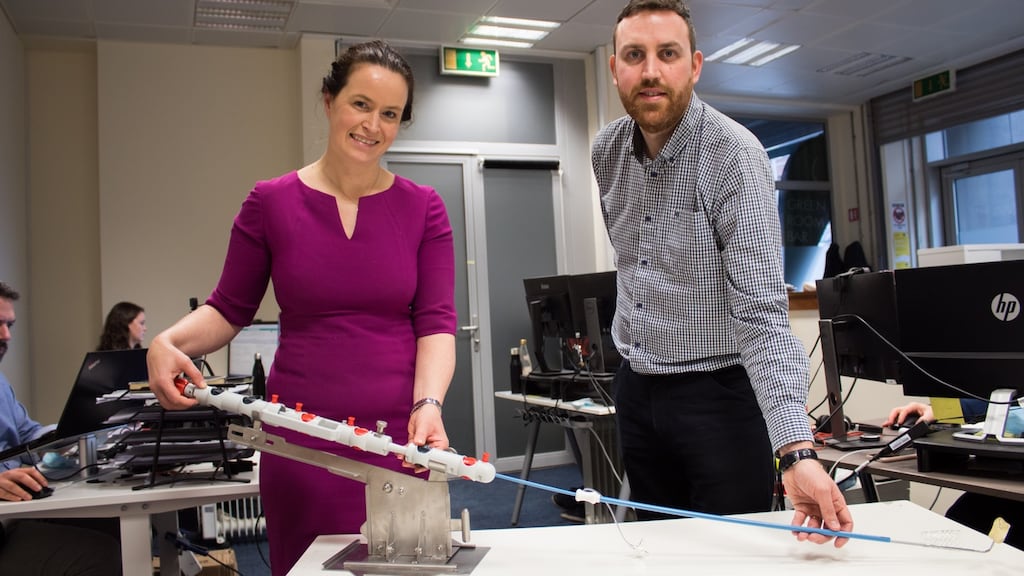 CroíValve chief executive Lucy O’Keeffe and R&D director Gavin Kenny with the device.
