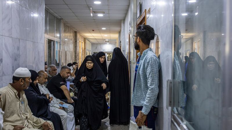 Crowds at a cancer hospital in Basra: The flared gas is enough to power three million homes and burning it is making people sick. Photograph: Ivor Prickett/New York Times