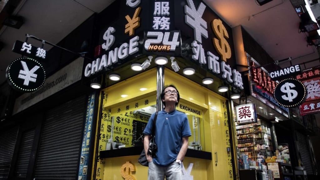 Foreign currency exchange booth in Hong Kong:  the surprise devaluation of the Chinese yuan this week unsettled global financial markets. Photograph: Philippe Lopez/AFP/Getty Images