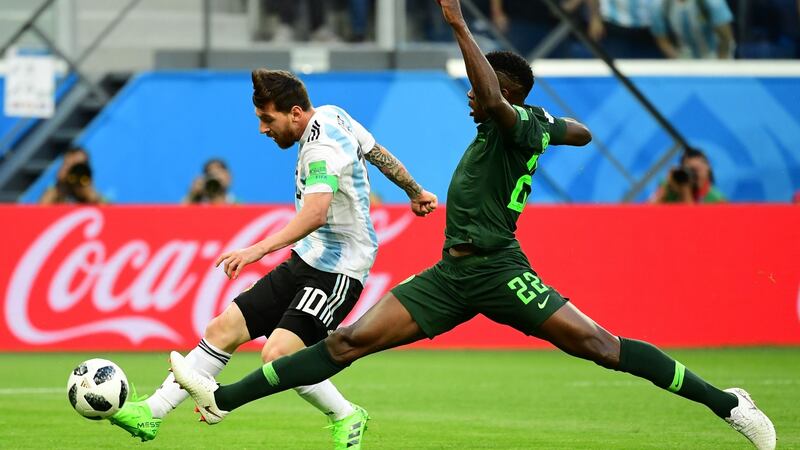 Lionel Messi scores against Nigeria. Photograph: Giuseppe Cacace/AFP/Getty