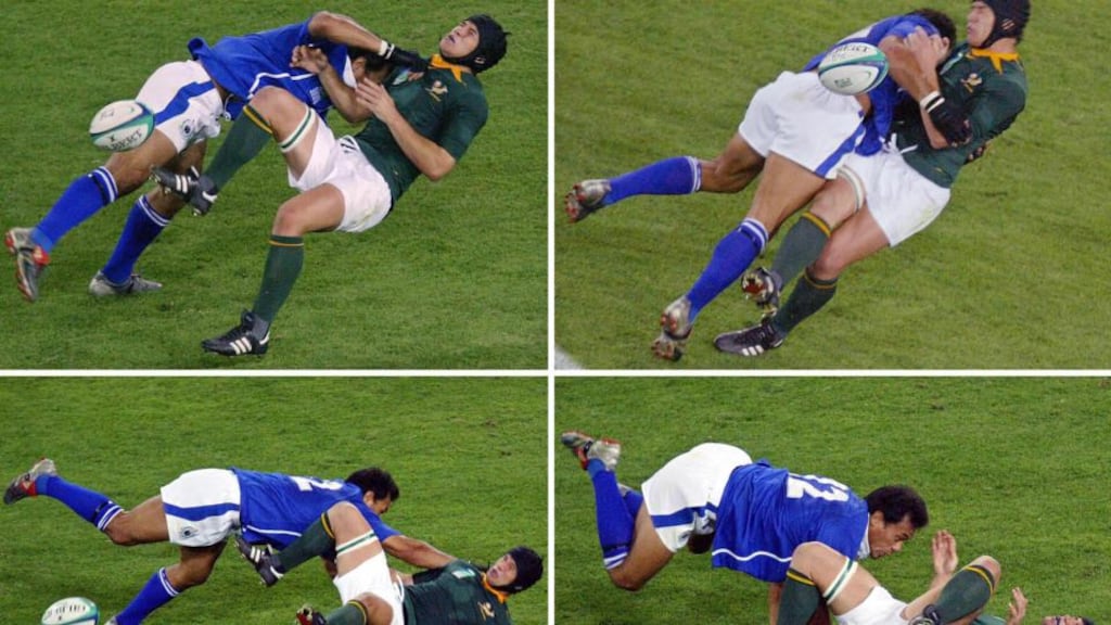Samoan centre Brian Lima tackles South African halfback Derick Hougaard during the Rugby World Cup Pool C match between South Africa and Samoa at Lang Park at the 2003 Rugby World Cup. Photo: Christophe Simon/Getty Images