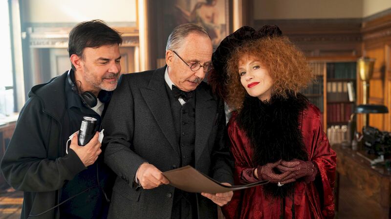 The Crime Is Mine: director François Ozon on set with Fabrice Luchini and Isabelle Huppert. Photograph: Carole Bethuel