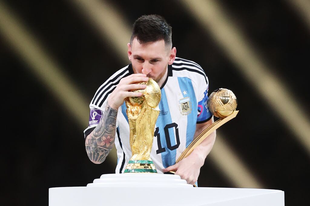 Lionel Messi kisses the World Cup after Argentina beat France in the 2022 final in Qatar. Photograph: Julian Finney/Getty Images.