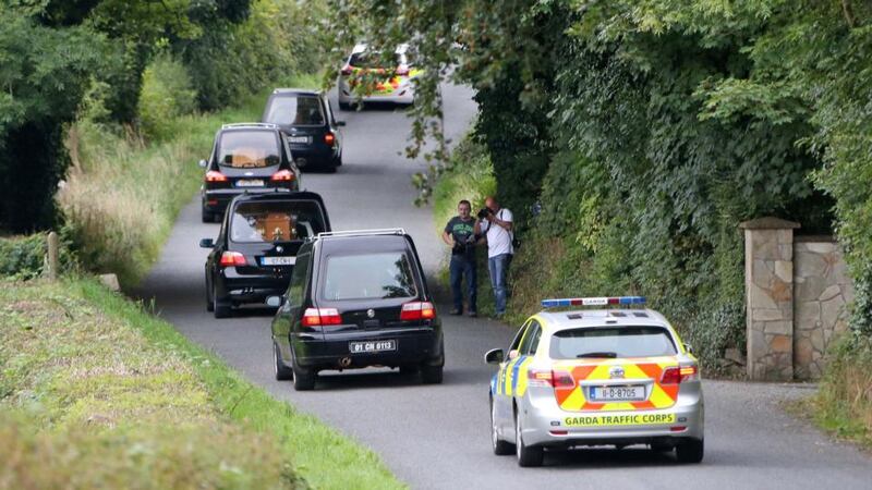 Shock: hearses shortly after leaving the Hawe home on Monday. Photograph: Colin Keegan/Collins