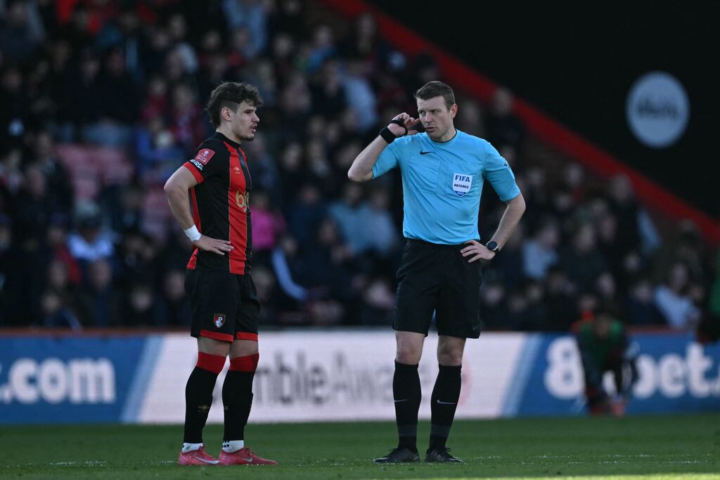 Bournemouth's Milos Kerkez and referee Sam Barrott wait as a VAR check is carried out during the FA Cup fifth-round fixture against Wolves earlier this month. Photograph: Justin Tallis/AFP via Getty Images