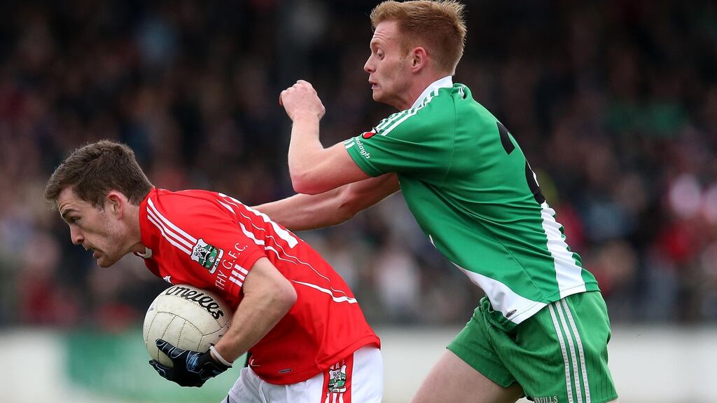 Athy’s Niall Kelly and Steven Lawlor of Sarsfields in action at the Kildare senior football final. Photograph: Ryan Byrne/INPHO