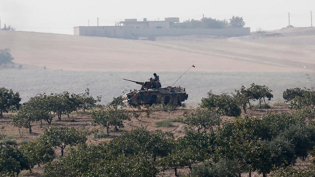 Turkish tanks patrol near the Turkish-Syria border during an operation against Islamic State in Syria. Photograph: EPA